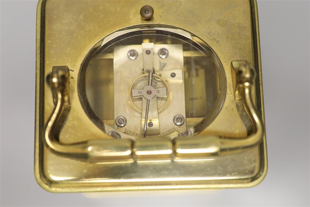 A brass carriage clock by Howell James & Co, height with handle down 13.5cm